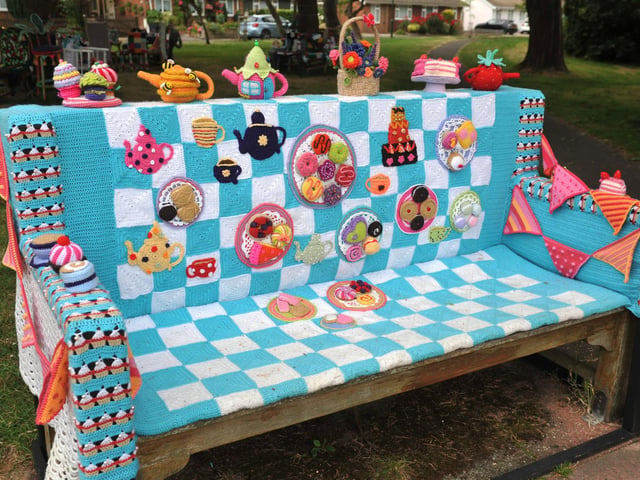 East Preston Yarnbombers have created an enchanting picnic area with chairs that are beautifully-decorated knitted masterpieces