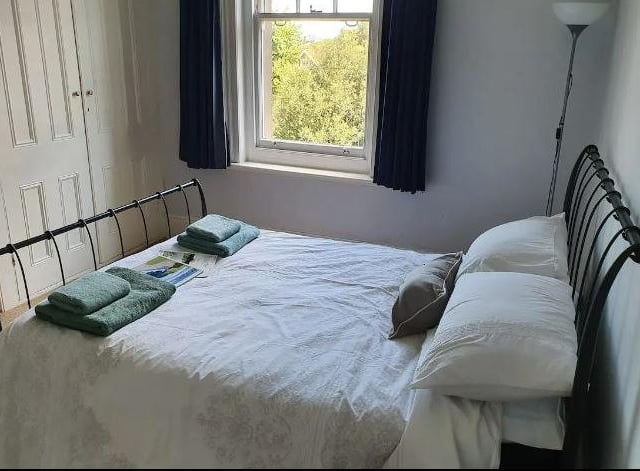 £95 per night (£23.75 per person) 
https://www.airbnb.co.uk/rooms/51139463?adults=2&children=2&check_in=2023-04-03&check_out=2023-04-16&source_impression_id=p3_1673606332_raaQ7HSuRO81jwF9