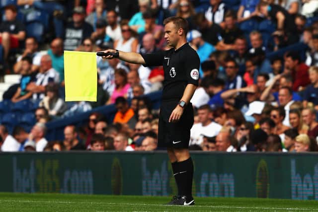 Assistant referee Harry Lennard flags during the Premier League match between West Bromwich Albion and Middlesbrough at The Hawthorns on August 28, 2016 in West Bromwich, England.  (Photo by Michael Steele/Getty Images)