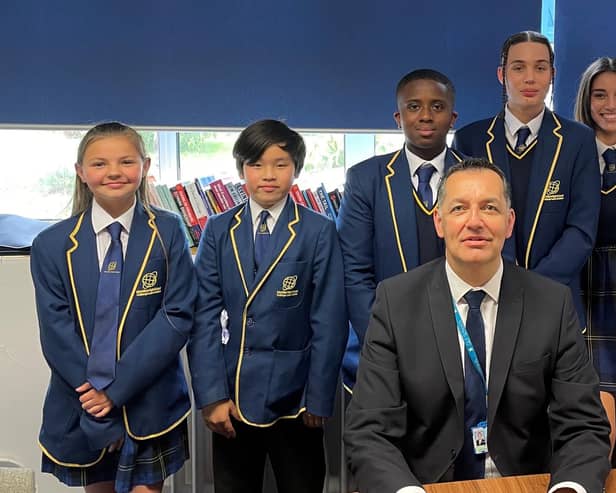 Jon Chaloner with pupils at one of the GLF Schools