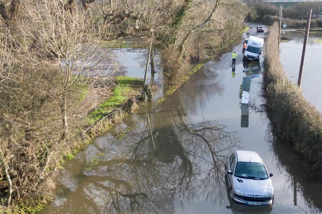 Cars have been abandoned in Barcombe Mills after the River Ouse burst its banks and flooded the roads.