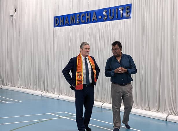 Labour leader Sir Keir Starmer is given a tour of the facilities by Bharat Lukka