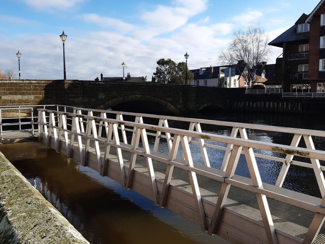 Take a look at the river by Arundel Bridge then carry straight on towards the Arundel Castle gates.