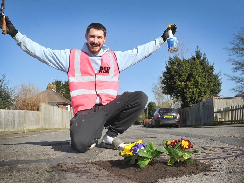 Harry Smith-Haggett planting up potholes Orchard Road, Horsham.