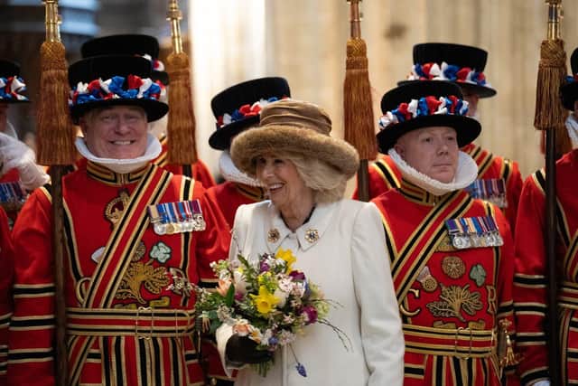 Queen Camilla shares a smile with one of the Yeoman of the Guard.