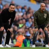 Manchester City manager Pep Guardiola (right) heaped praise on Brighton & Hove Albion head coach Roberto De Zerbi (left) in his post-match interview last [Tuesday] night following City's thumping 7-0 home win over RB Leipzig in the UEFA Champions League round of 16. Picture by OLI SCARFF/AFP via Getty Images.