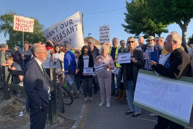 Nick Gibb MP confronts protestors outside the Bognor Regis Golf Club