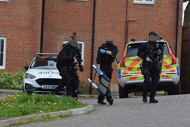 Four people have been arrested in an East Sussex village after a man was taken to hospital with injuries consistent with a stabbing, police said.