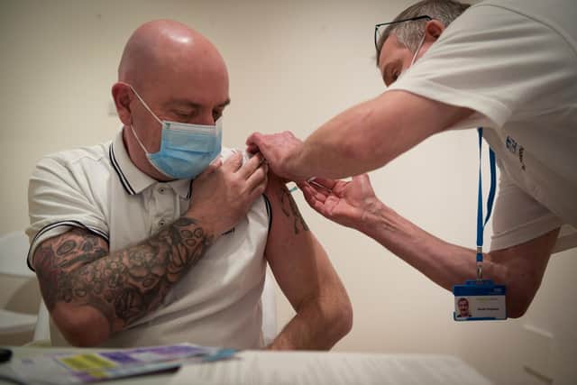 A Covid-19 vaccination being administered (Photo by Finnbarr Webster/Getty Images)