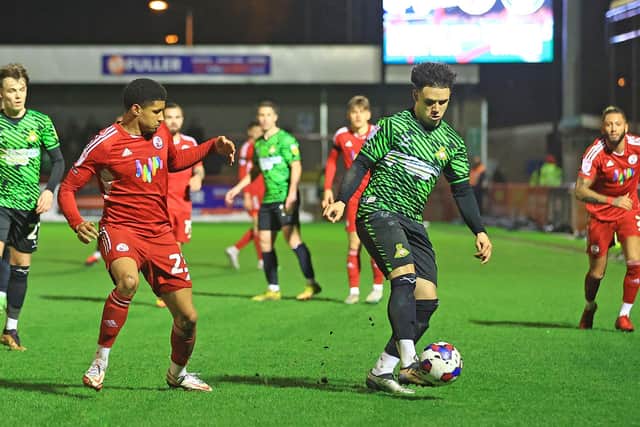 Doncaster Rovers' Charlie Seaman protects the ball from Crawley Town's Travis Johnson. Photo: Gareth Williams/AHPIX LTD
