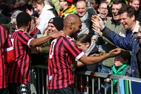 Ryan Gondoh and his Lews team-mates celebrate with the Rooks faithful after his second in the 4-1 win at Bognor | Picture: James Boyes