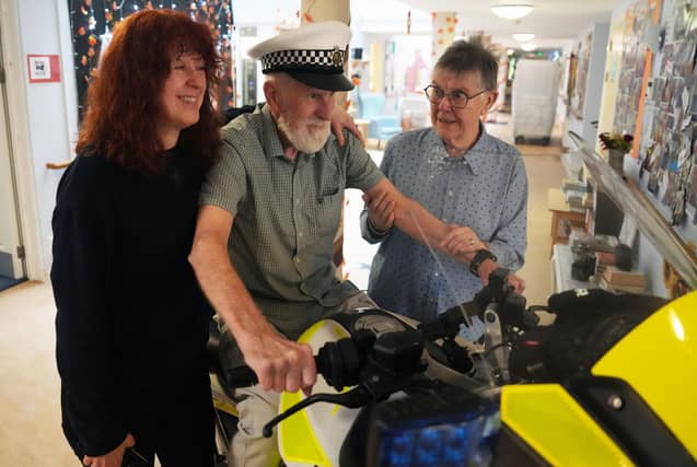 The surprise sight of a police motorbike in a Steyning care home foyer brought decades of memories rushing back for 89-year-old Alan Colbourne (pictured with his wife Shirley and daughter Amanda)