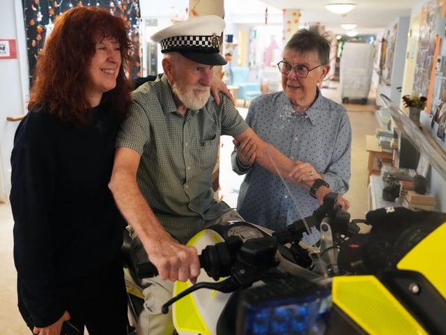 The surprise sight of a police motorbike in a Steyning care home foyer brought decades of memories rushing back for 89-year-old Alan Colbourne (pictured with his wife Shirley and daughter Amanda)