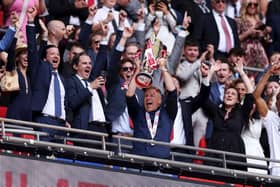 LONDON, ENGLAND - MAY 19: Scott Lindsey, Manager of Crawley Town, lifts the Sky Bet League Two Play-Off Final trophy after the team's victory in the Sky Bet League Two Play-Off Final match between Crawley Town and Crewe Alexandra at Wembley Stadium on May 19, 2024 in London, England. (Photo by Paul Harding/Getty Images)