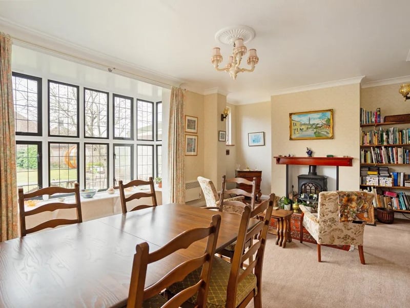 The formal dining room and sitting room both have feature fireplaces.