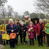 Members of the Priory Park Society and Rotary Club of Chichester with the potentially life-saving defibrillator