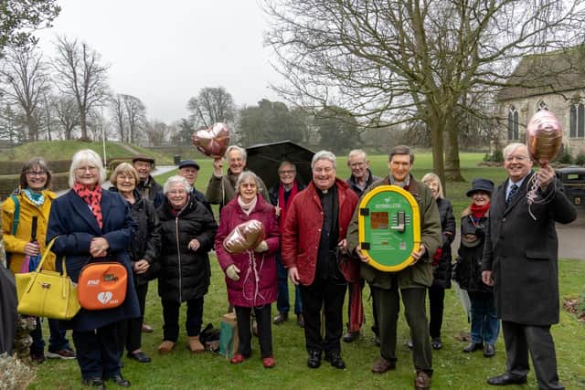 Members of the Priory Park Society and Rotary Club of Chichester with the potentially life-saving defibrillator