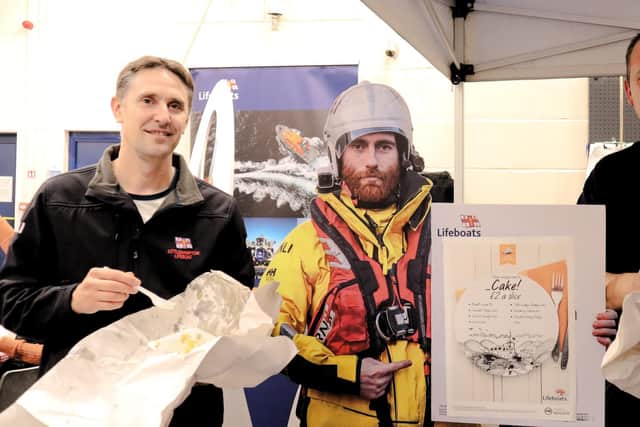 Two of the four lifeboat crew, Jason (left) and Adam (right), enjoy their fish and chips before having to abandon their meal due to the emergency call-out. Photo: Littlehampton RNLI