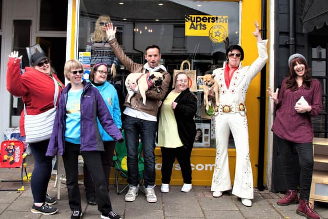 The Great Pottery Throw Down finalist Adam Johnson and Suspiciously Elvis with Jo Sullivan and the Superstars at the official opening of the Superstar Arts charity shop in May 2021