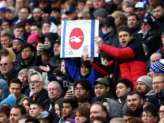 BRIGHTON, ENGLAND - JANUARY 29: Fans of Kaoru Mitoma of Brighton & Hove Albion show their support with a homemade Japan flag during the Emirates FA Cup Fourth Round match between Brighton & Hove Albion and Liverpool FC at Amex Stadium on January 29, 2023 in Brighton, England. (Photo by Bryn Lennon/Getty Images)