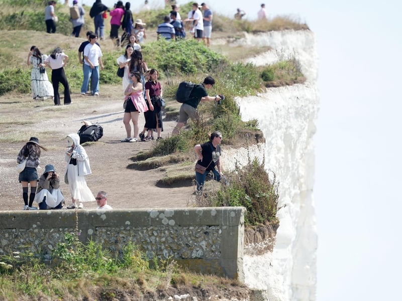 Shocking photos show sunbaskers standing near edge of cliffs at Birling Gap