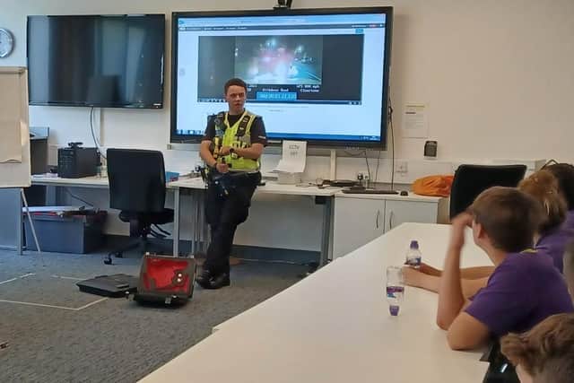PC Jordan Smith from the Roads Policing Unit (RPU) talks to the students.