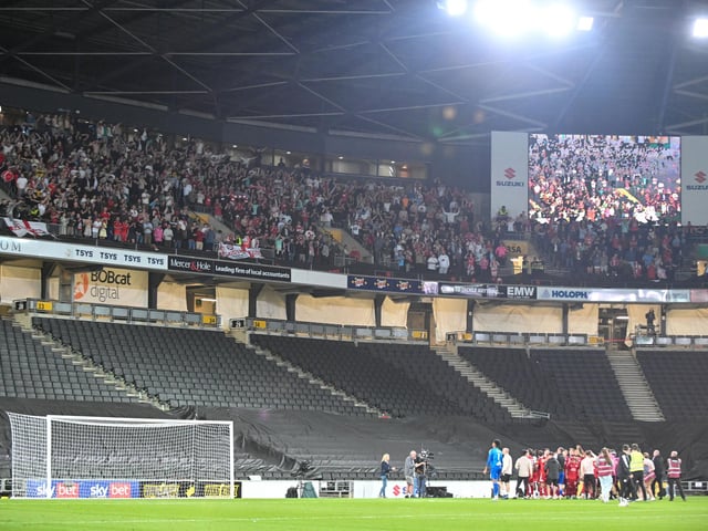 The Crawley Town players celebrate in front of their supporters during the EFL Sky Bet League 2 play-off second leg match between Milton Keynes Dons and Crawley Town at stadium:mk, Milton Keynes, England on 11 May 2024.:Crawley Town hammered MK Dons 5-1 - and 8-1 on aggregate - to reach the League Two play-off final Wembley. Photographer Dennis Goodwin/Pro Sport Images was there to catch the action, the crowd and the celebrations