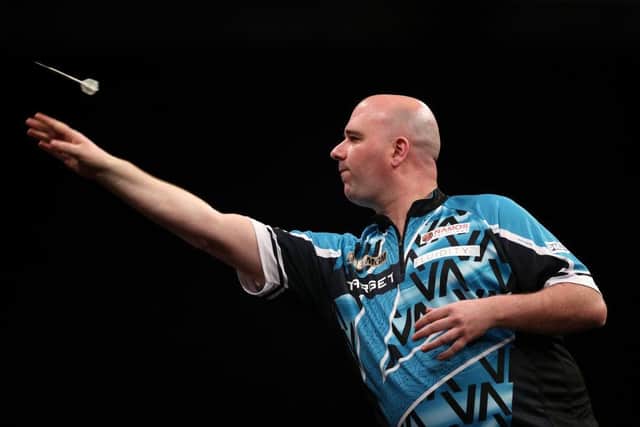 Rob Cross of England throws against Luke Humphries of England (not pictured) during the Semi Final match on Night Four of the 2025 BetMGM Premier League Darts at the Westpoint Arena on February 27, 2025 in Exeter, England.  (Photo by Ryan Hiscott/Getty Images)