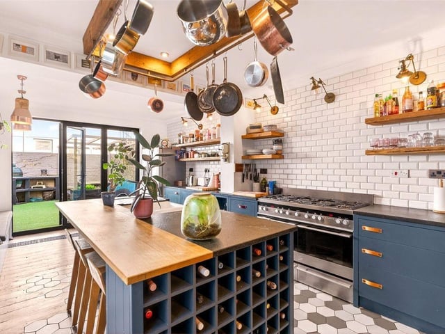 The contemporary kitchen is a true feature of the home, complete with central island