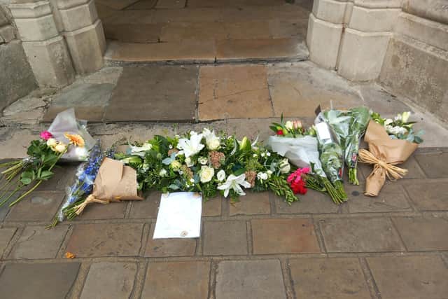 Flowers have been laid for The Queen at Chichester's Market Cross