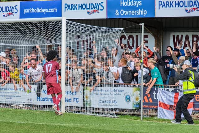 Ayo Olasimbo and Hastings United fans celebrate the amazing comeback v Crowborough | Jon Smalldon