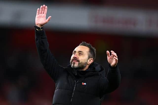 Roberto De Zerbi, manager of Brighton & Hove Albion acknowledges the fans following their side's victory in the Carabao Cup Third Round match at Arsenal