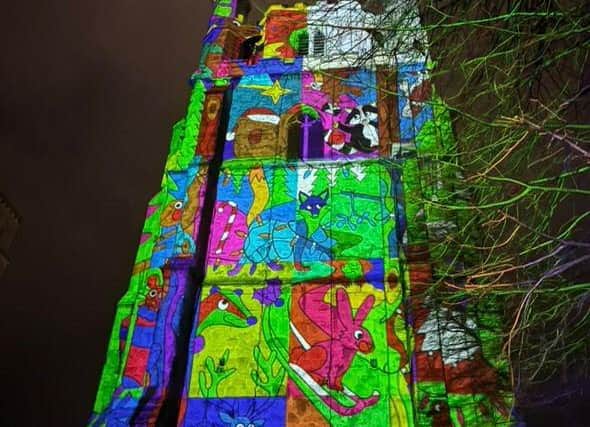 Participants paint with light and see they designs projected onto the ancient Bell Tower