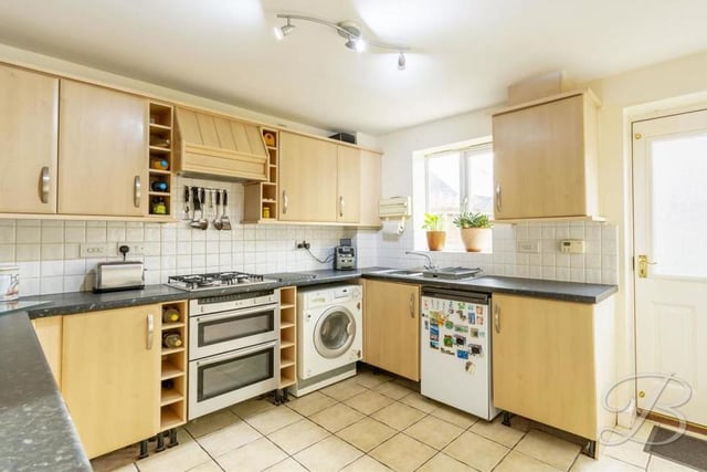 The kitchen really does have all you need, including an inset sink and drainer with a mixer tap above. The window faces the back of the property, while the door provides access to the back garden.