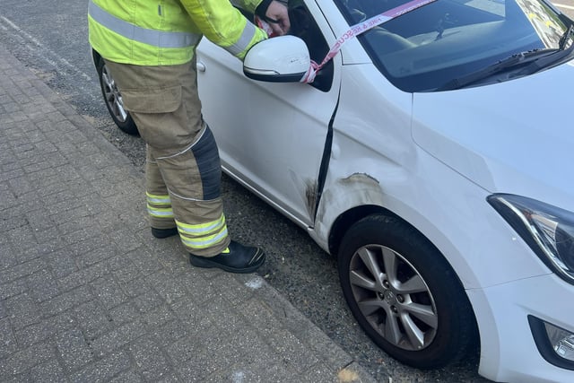 Two people taken to hospital after car collides with building in West ...