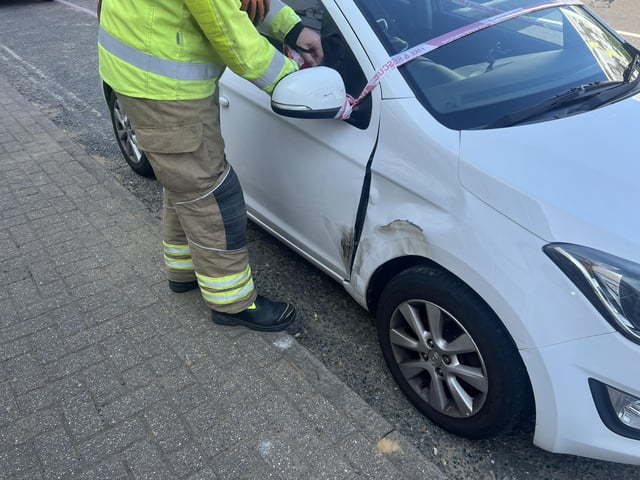 Two people taken to hospital after car collides with building in West Sussex