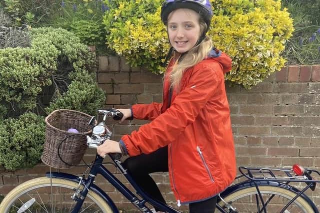 Lilly on her bike. She will attempt a ride of more than 500 miles this April