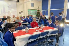 Children and guests enjoying the SVP Senior Citizens Tea Party at OLQOH School earlier this month.