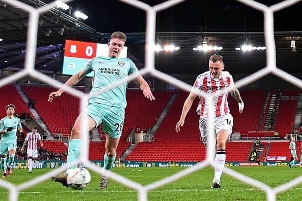 Brighton's Irish striker Evan Ferguson scores the opening goal of the English FA Cup fifth round at Stoke City
