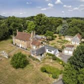 This seven-bedroom property comes with a two-bed barn conversion, two-bed annexe and park-like gardens