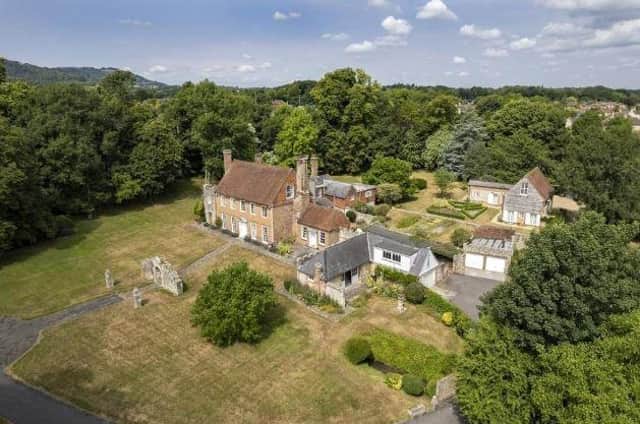 This seven-bedroom property comes with a two-bed barn conversion, two-bed annexe and park-like gardens