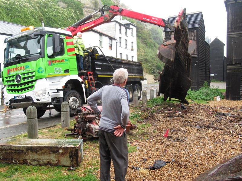 Tush Hamilton watches as the remains of the RX 124 are lifted onto a lorry