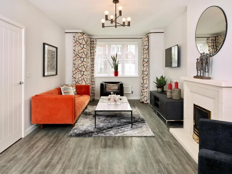 The sitting room has a stone feature fireplace