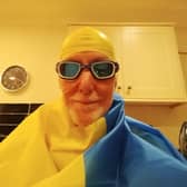 Julian gets ready to swim in his Ukrainian colours