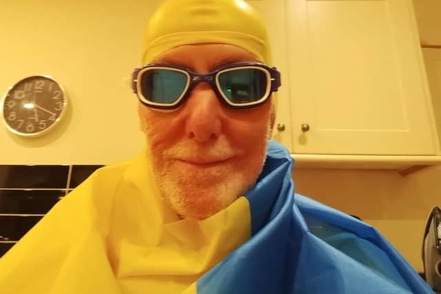 Julian gets ready to swim in his Ukrainian colours