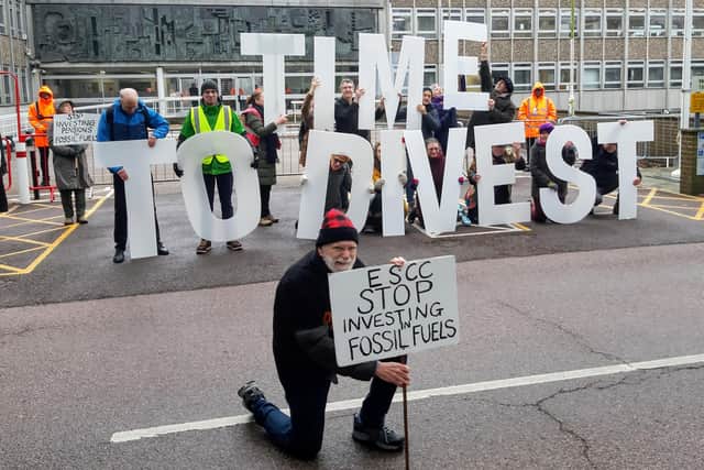 Members of Divest East Sussex held up a huge message at County Hall in Lewes on Tuesday, February 6