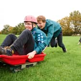 Scouts have fun Grass Sledging!