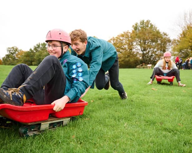 Scouts have fun Grass Sledging!