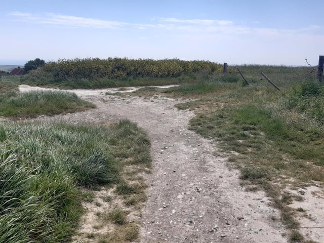 You will quickly come to a crossroads of paths, where you turn right to go down what is known as Norton Drive, around the back of Woodingdean.