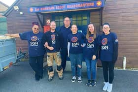 Volunteers from gas company SGN have helped to give a new lease of life to a Horsham Scout group's sheds